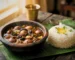 "Sundakai Vattal Kulambu served with steamed rice"